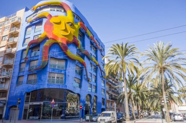 Big sculpture sun attached building of Juan Garcia Ripolles in El Grao, maritime district.Castellon,Spain. clipart