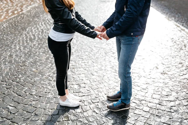 Cropped image of a couple holding hands and facing each other — Stock Photo, Image