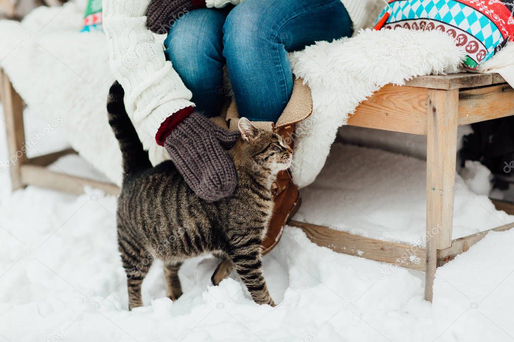 woman and cat in winter