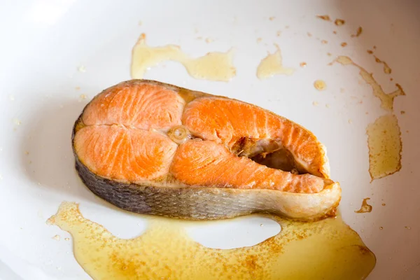 Salmon steak fried in pan