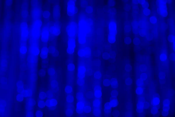 Abstract blurred blue background. The lights of illuminations or lights in a blur. Bokeh and defocusing — Stock Photo, Image