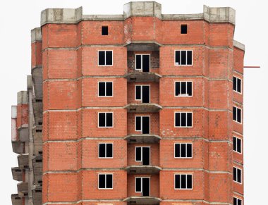 The construction of multi-storey houses of red brick clipart