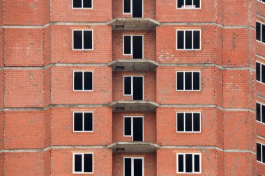 The construction of multi-storey houses of red brick clipart