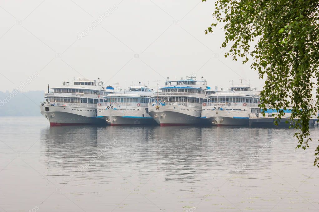 Four tourist boat at the Wharf on the Volga river. Russia, Plyos, Ivanovo region. River cruises