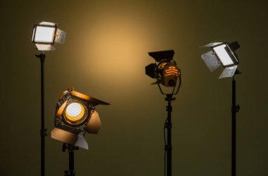 Halogen and led lights. Spotlights with Fresnel lenses. Studio photography. Photo and video shooting. clipart