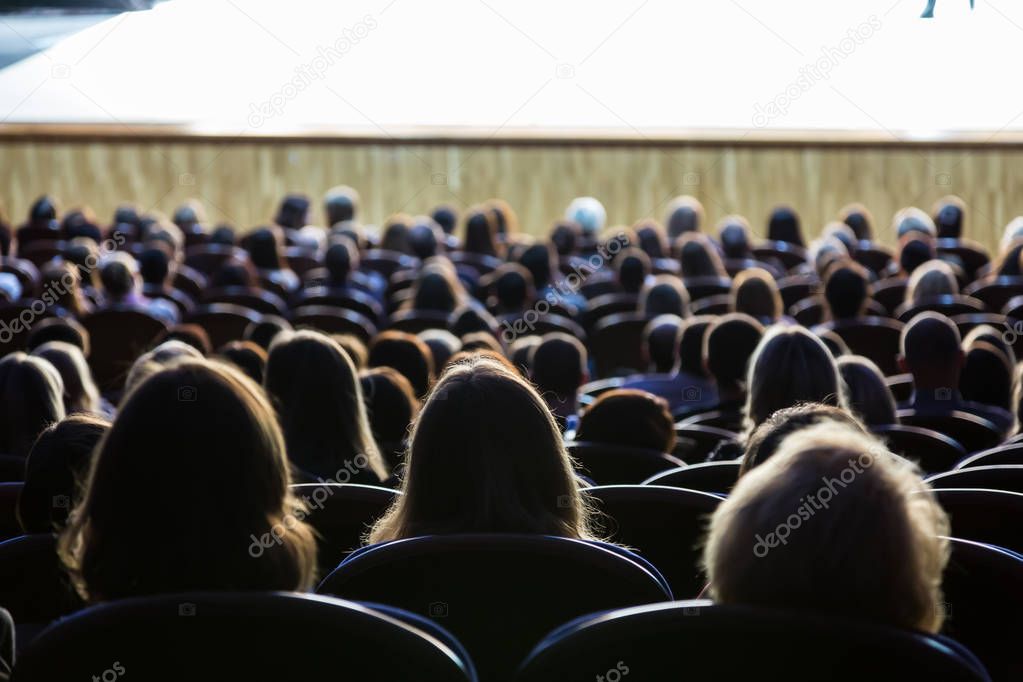 People in the auditorium during the performance. A theatrical production
