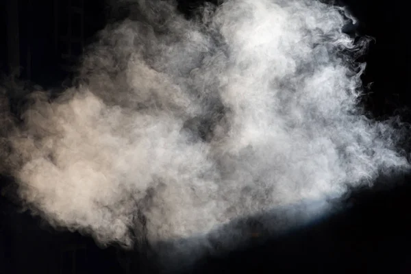White theatrical smoke on stage during a performance or show.