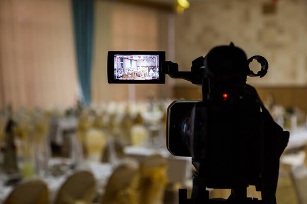 Filming of the event. Videography. Served tables in the Banquet hall.