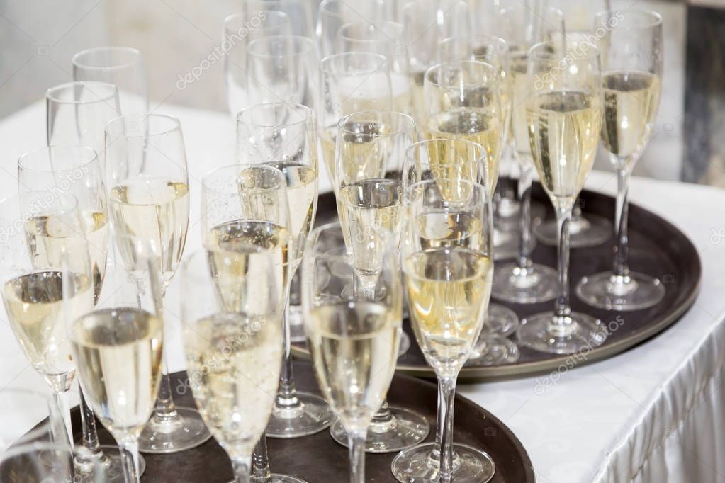 Champagne is poured by the glass. Gala reception or wedding