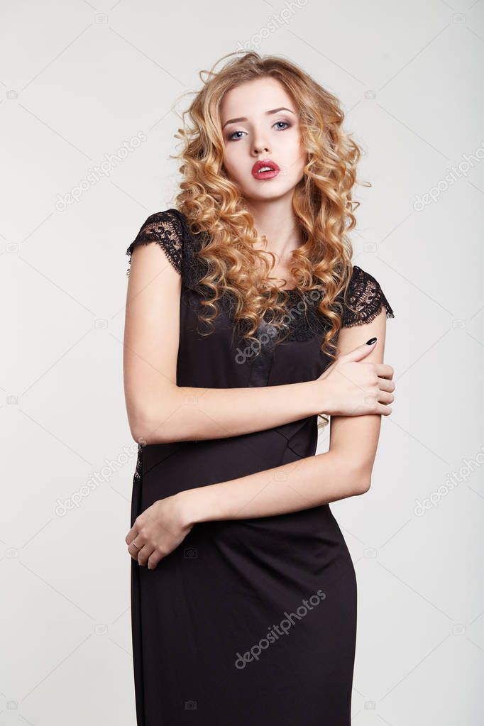 Beauty woman in a black dress white background hairstyle