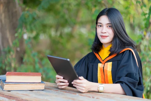 Young Cheerful Beautiful Female Gradute Student Wearing Academic Gown Studying — Stock Photo, Image