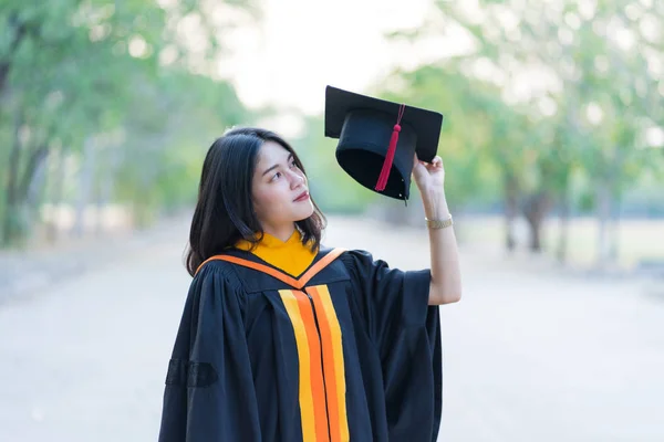 Portrait Young Cheerful Female Graduate Wearing Academic Gown Holding Graduate — Stock Photo, Image