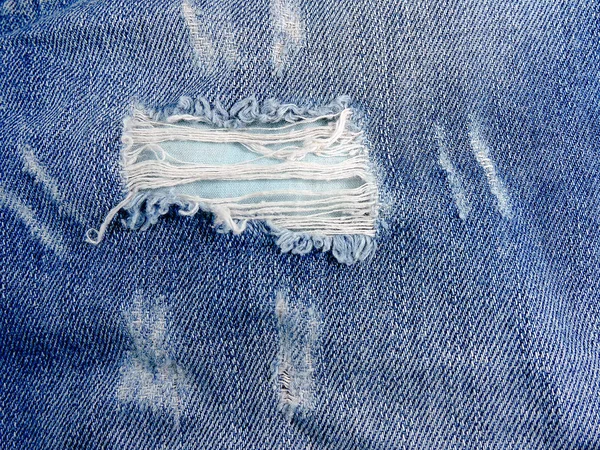 破れたジーンズの背景。クローズ アップ. — ストック写真