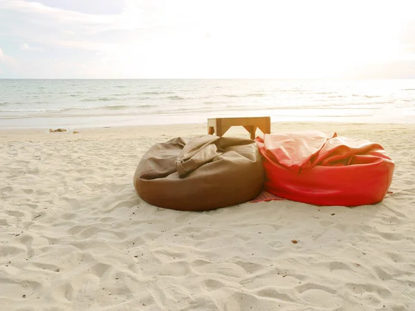 Bean bags and tables set on the beach — Stock Photo, Image