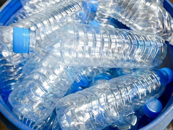 Empty bottled water in big bucket