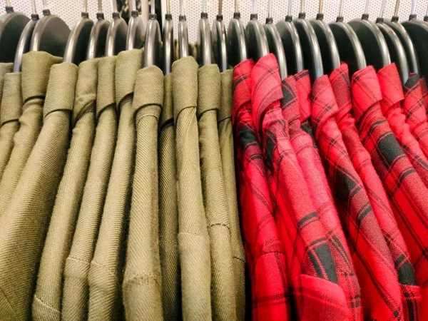 Olive green and red plaid collared shirts — Stock Photo, Image