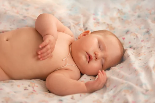 Baby sleeping sweetly on the bed — Stock Photo, Image