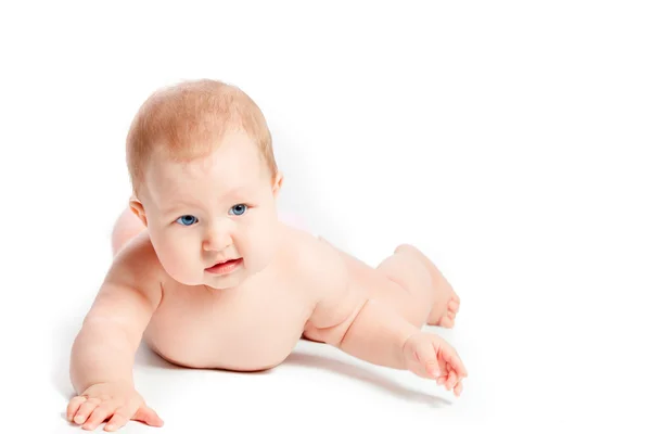 Baby lying  on white background — Stockfoto