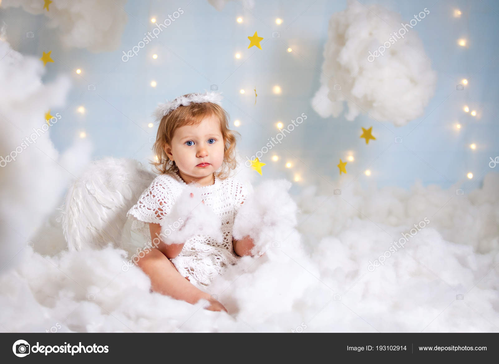 classical child angels sitting on clouds