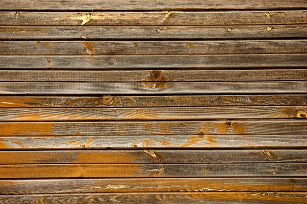 Tábuas de madeira velhas com um fundo marrom — Fotografia de Stock