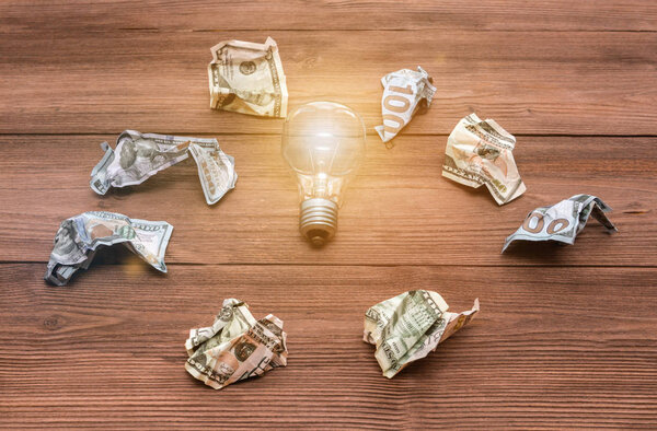 Collaborate four hands trying to connect a puzzle piece with a sunset background. A puzzle in hand against sunlight. One part of the whole. 