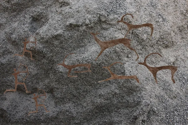 Cave paintings of primitive man.