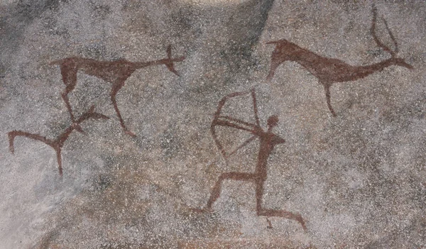 Dessin d'un homme ancien dans une grotte. Chasse aux animaux. Neanderthale primitif, aborigène, homme des cavernes — Photo