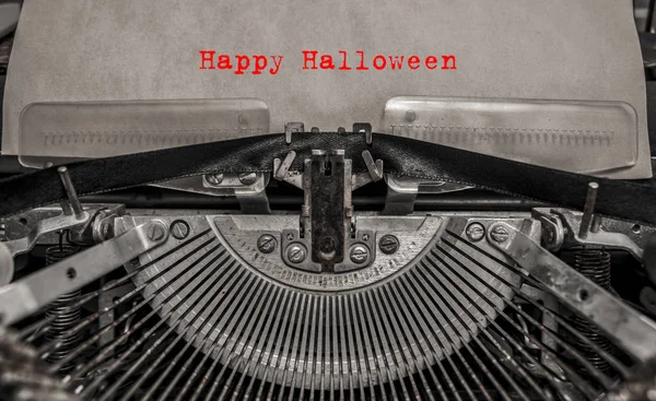 Happy Halloween printed on a vintage typewriter. old typewriter with text red happy halloween