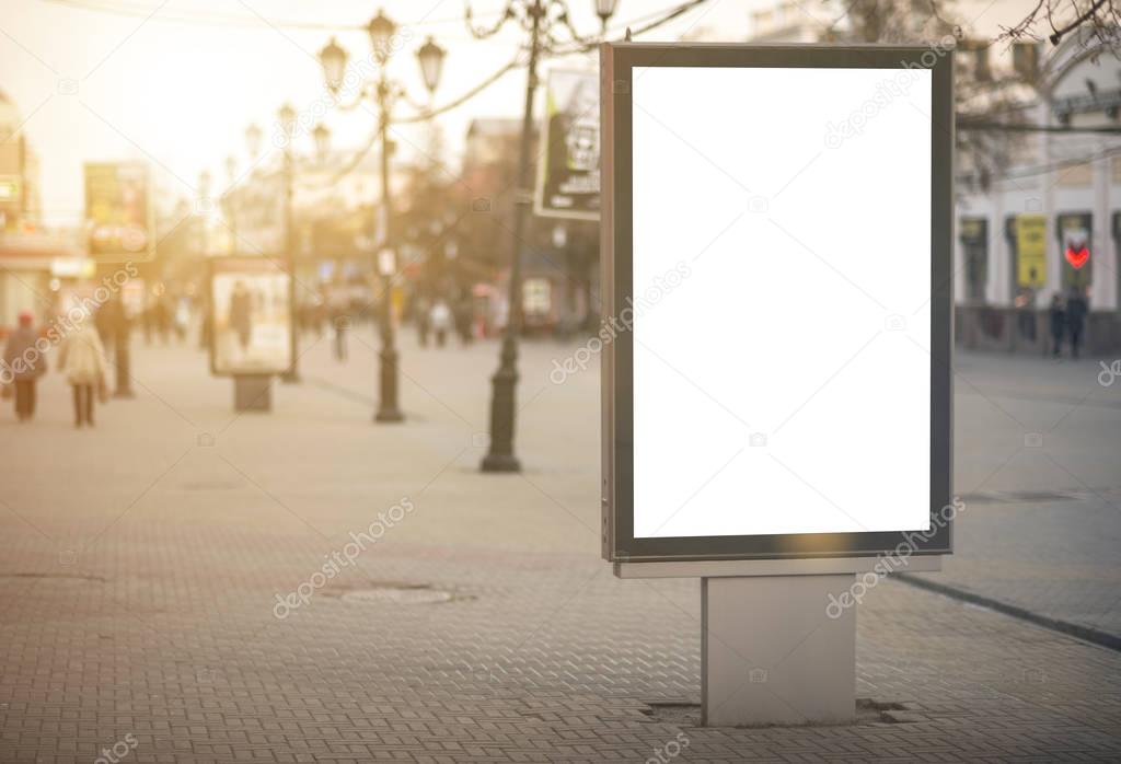 Vertical Isolated blank billboard on the city street. Mock up. for your advertising design