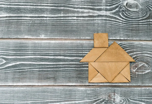 Rompecabezas Forma Casa Sobre Fondo Madera — Foto de Stock