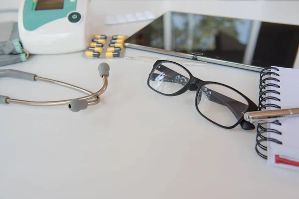 Stethoscope and Medical equipment. Doctor workplace in office . — Stock Photo, Image