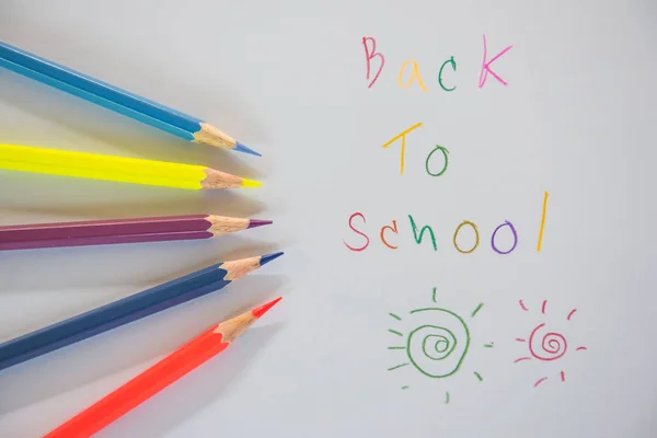 Back to school Written on white paper and Crayon — Stock Photo, Image