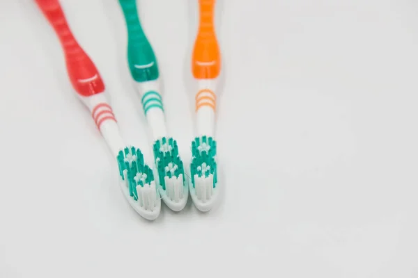 Closeup new toothbrushes isolated on a white background — Stock Photo, Image