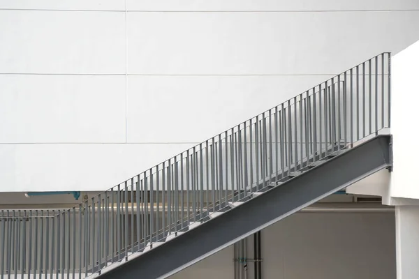 Building and stairs black steel and White building wall . Space for text and images.