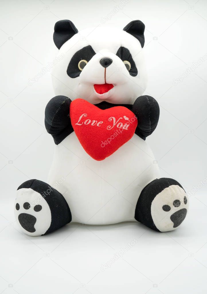 Panda doll and red heart love you  isolated on white background .
