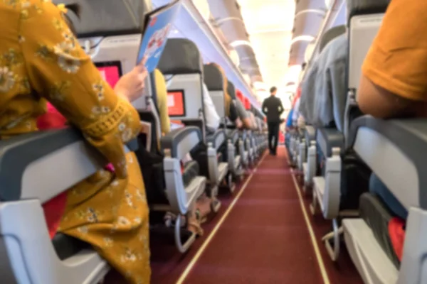 Rozmycie Streszczenie Wewnątrz Samolotu Pasażerów Podróżujących Samolotem — Zdjęcie stockowe