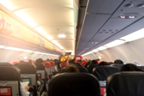 Rozmycie Streszczenie Wewnątrz Samolotu Pasażerów Podróżujących Samolotem — Zdjęcie stockowe