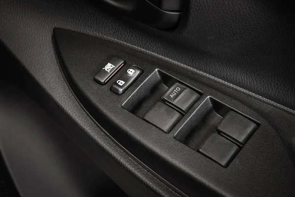 Car Door Lock Button Closeup. Electric Locking Button in Modern Car