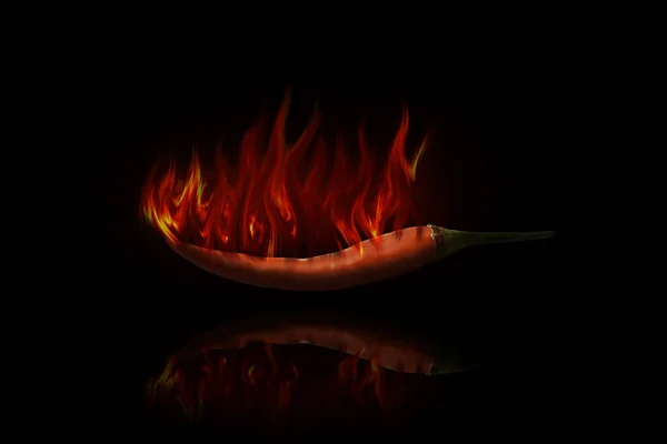 Red hot chili pepper on black background with flame — Stock Photo, Image