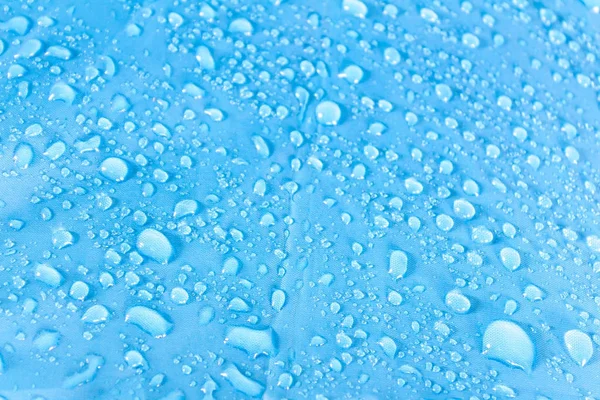 Kapky vody na modrém patře — Stock fotografie