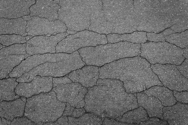 Asfalto estrada rachaduras textura fundo — Fotografia de Stock