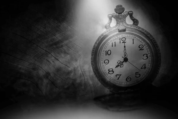 Vintage clock on old black wood floor. — Stock Photo, Image