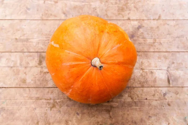 Pumpkin on wooden background — Stock Photo, Image