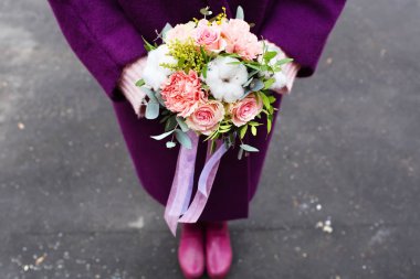 Beautiful children's bouquet in female hands clipart