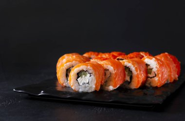 Philadelphia Japanese rolls with fresh salmon, soft cheese, cucu
