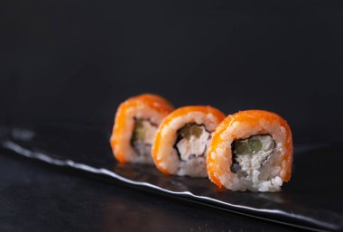 Philadelphia rolls and with fresh salmon, rice, soft cheese and 