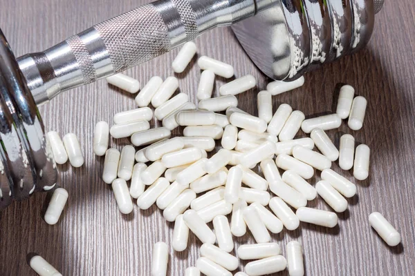 Spor takviyeleri vücut geliştirme için. Protein, bcaa, halter ve arka plan üzerinde