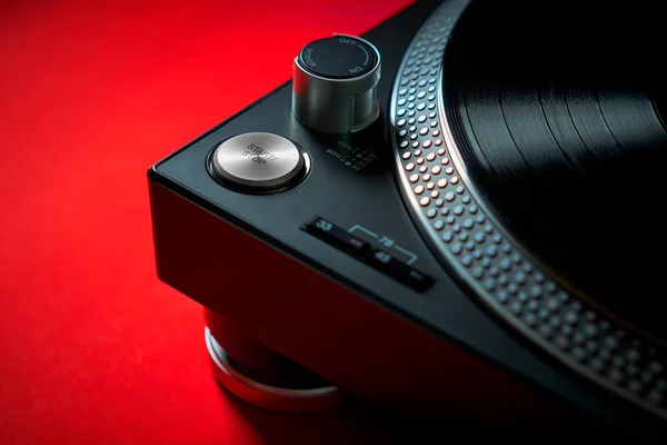 Modern black turntable on a red background — Stock Photo, Image