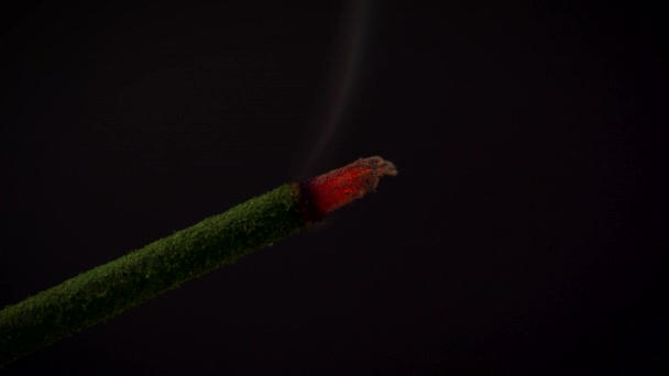 Isolated burning incense on a black background — Stock Video