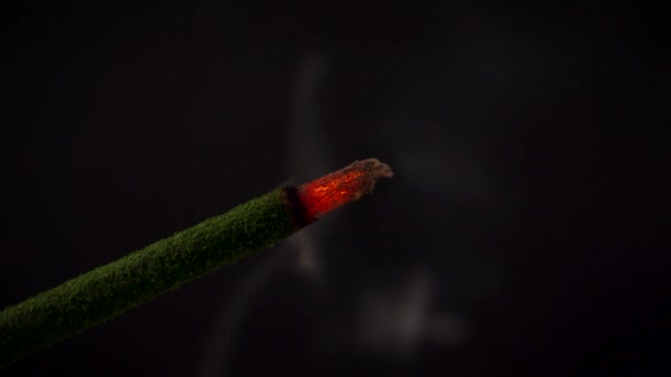 Isolated burning incense on a black background — Stock Video